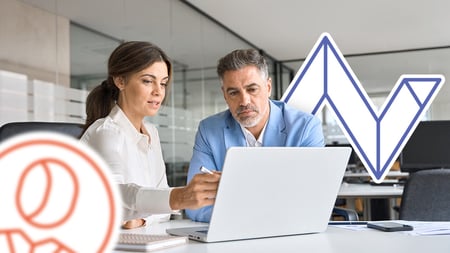 two people working at a computer